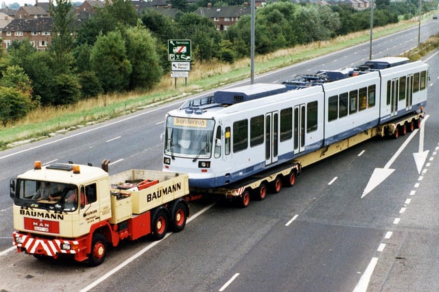 Supertram arrives in Sheffield on the back of a low loader travelling along the Parkway to the depot in Nunnery Lane in August 1993
