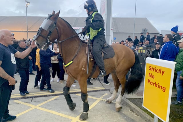 Police ran their 'biggest ever football operation' in Hampshire on September 24 as Pompey played Southampton at Fratton Park for the third round of the Carabao Cup.

Pictured is: Blues fans at the Shell garage in Goldsmith Avenue.

Picture: Ben Fishwick (240919-9794)