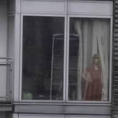 Commuters have rallied to keep a cardboard cut-out of Taylor Swift on display in a flat window despite its owner moving out - after it became a landmark for tram users in a city centre