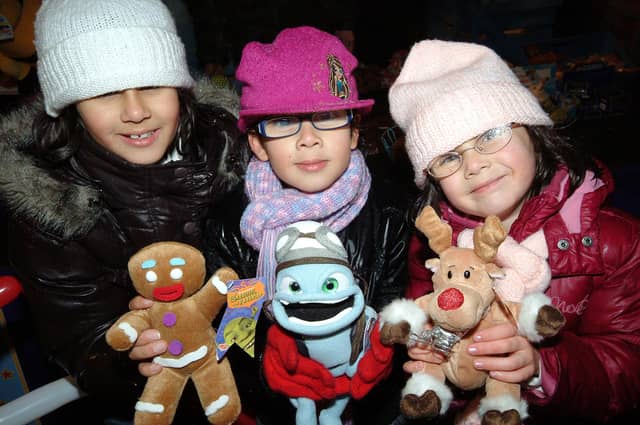 Kirkby lights switch on.
Shama, Natasha and Annabel Kika display their winnings.