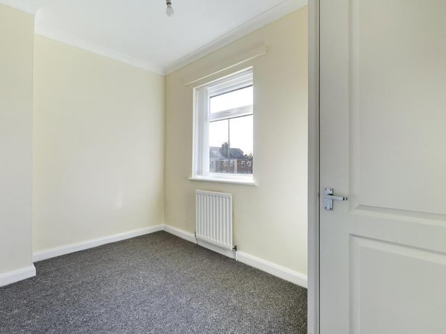Bedroom 3 - uPVC double glazed window to the rear elevation, ceiling coving, radiator panel and power point.