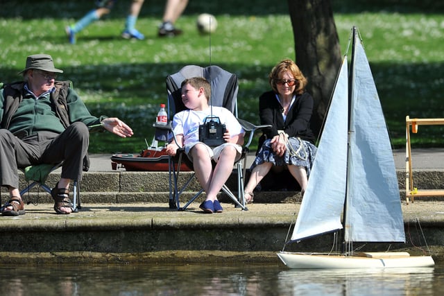 Michael Daley (10) takes advice from his granddad Michael Porritt as Nana Pat keeps an eye on his boat in the pond at Ward Jackson Park in 2012.