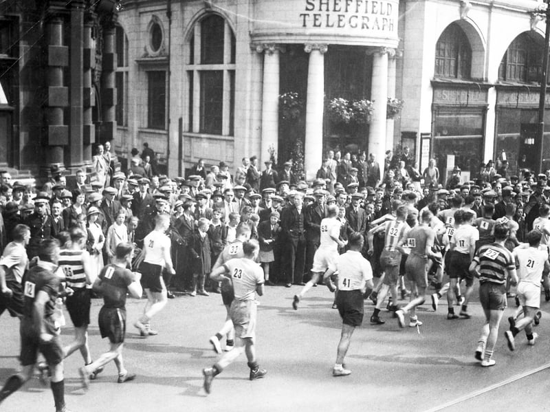 Walkers in the Star Walk pass down High Street, Sheffield, in the 1930s