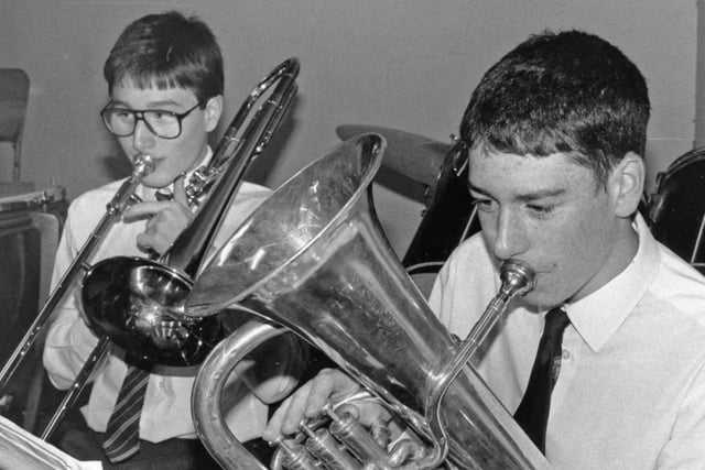 Who recognises the concert band players pictured in 1985?