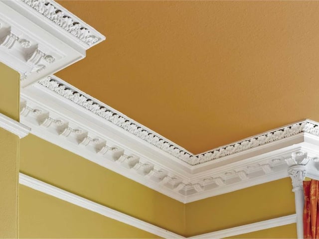The living room has a number of original features such as elegant cornicing.