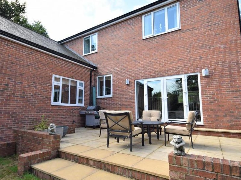 Moving round the back, where this raised patio area is perfect for outdoor entertaining or dining. Imagine spending your summer evenings here.