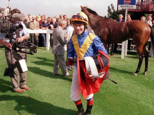 Winner K Fallon after winning a race in 1999.