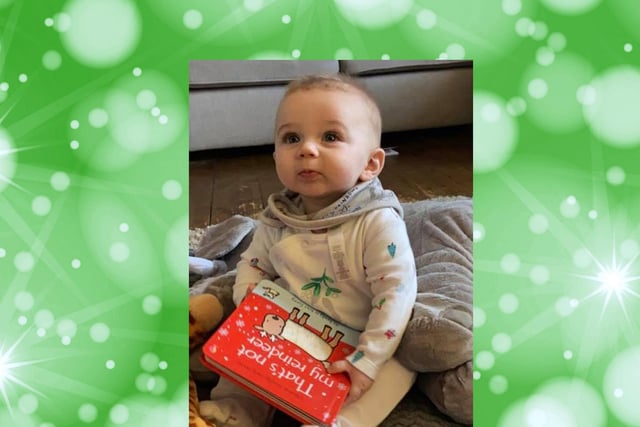Six-and-a-half-month-old Ted with his book.