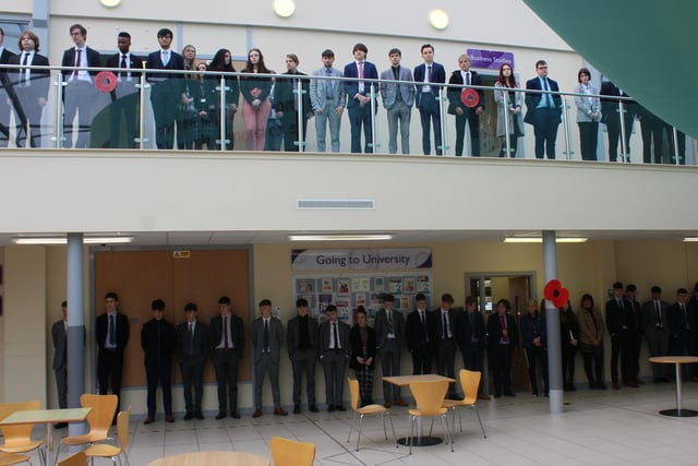 Students observing the two minute silence and The Last Post performance in the Post 16 Centre.
