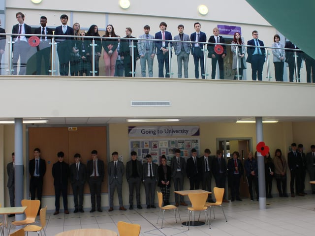 Students observing the two minute silence and The Last Post performance in the Post 16 Centre.