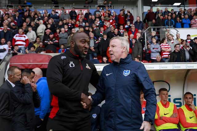 Darren Moore shakes hands with Portsmouth boss Kenny Jackett