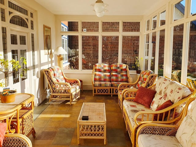 The sun room. Bourne End House also boasts a private, traditional themed pub on site for the exclusive use of guests.