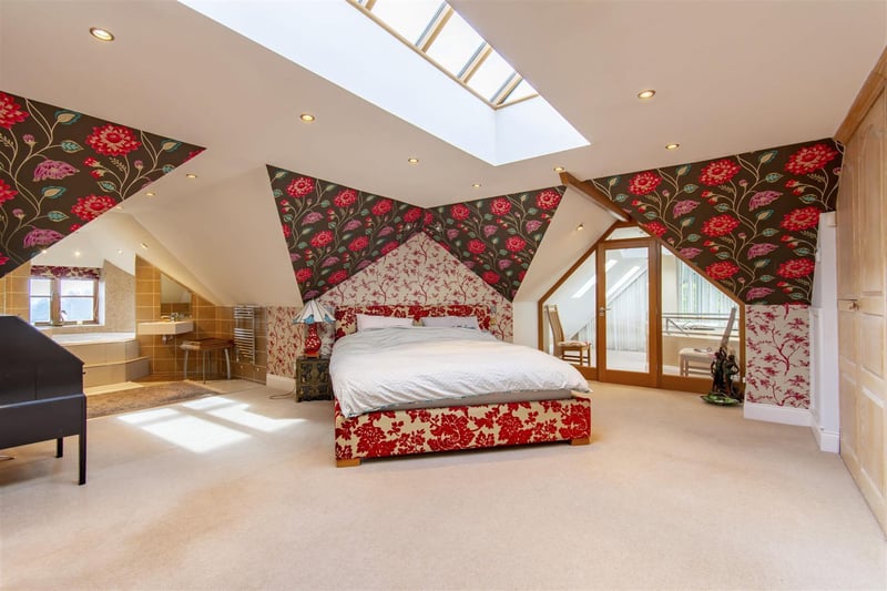 The property has four bespoke bedrooms and this master bedroom also has a dressing room
