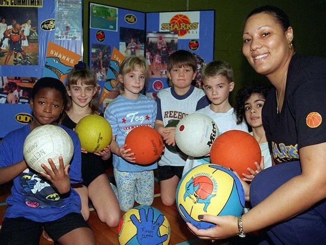 Elandra Farrior of the Sheffield Sharks development team with some of the Y3 pupils at the Nether Green Junior School who received tuition at the school in basketball, November 1997