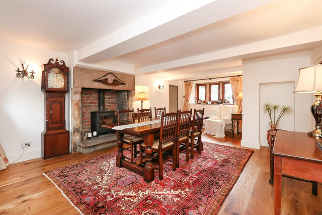 The dining room has a log burner fire place.