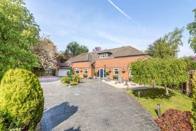 This five bedroom house has a "lovely sunny" conservatory "perfect for casual dining", doors open out onto the patio and garden.