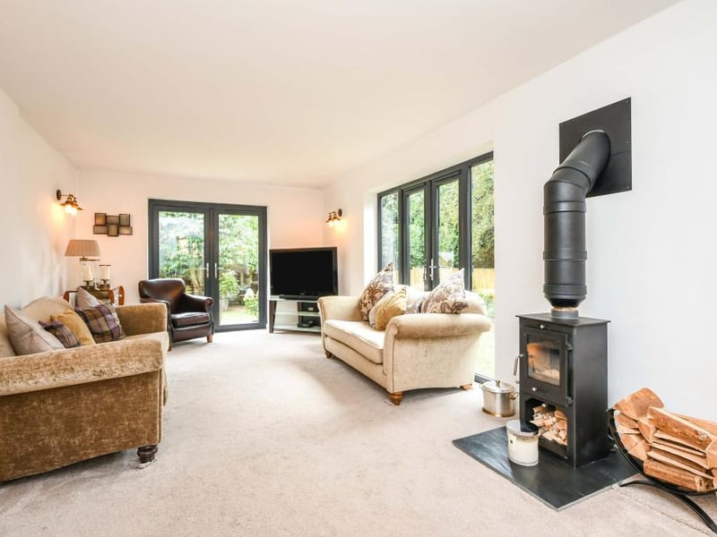 The living space is a wonderful family area with two sets of French doors out to the garden, a floor-to-ceiling window along with one out to the front.