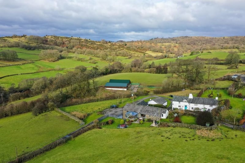This property sits in 22 acres of open fields and stunning woodland.