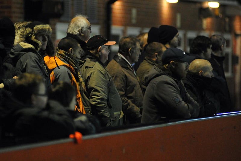 Worksop fans watch on as their team take on Mansfield Town in a cup tie at Ilkeston in 2010.
