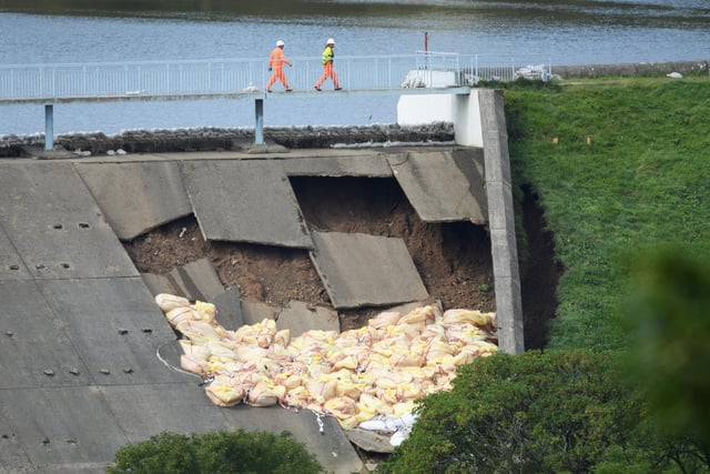 On August 2, 2019 members of the emergency services checked the positioning of sandbags after they were dropped onto the dam wall at Toddbrook reservoir.