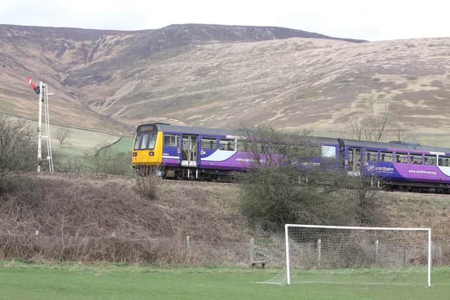 A local train at Edale on the Hope Valley Line through the Peak District between Sheffield and Manchester.