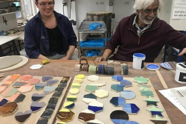 Pottery manager Mike Scown and tutor Krishna