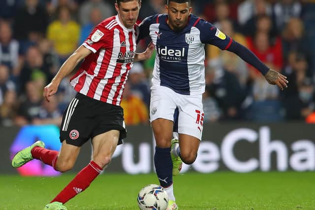 Chris Basham of Sheffield United challenges Karlan Grant of West Bromwich Albion during the Sky Bet Championship match at The Hawthorns. Simon Bellis / Sportimage
