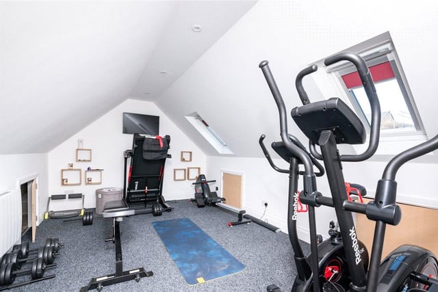 This small but functional gymnasium sits above one of the double garages and is spacious enough to accommodate several machines and pieces of equipment.
