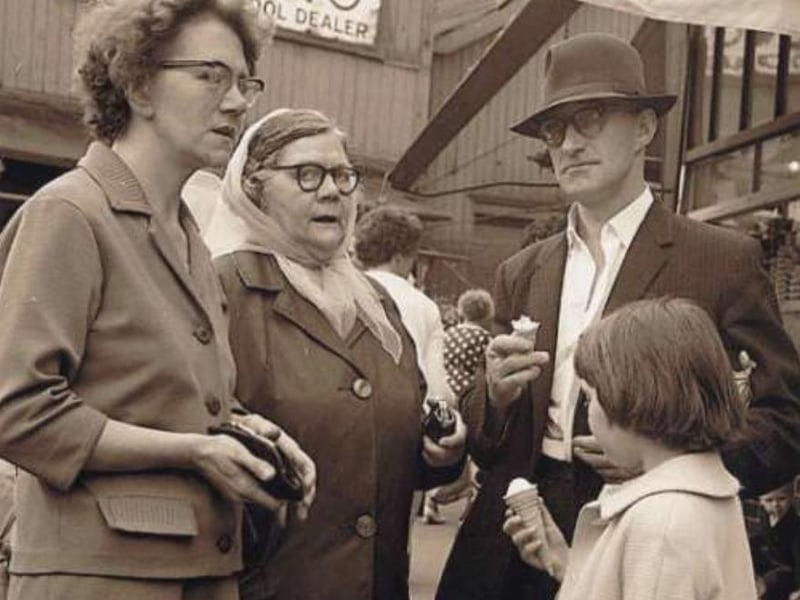 A family group eating ice cream in Sheffield's Rag Market (old Sheaf Market) outside L. Allen hardware dealer in the 1960s or 70s