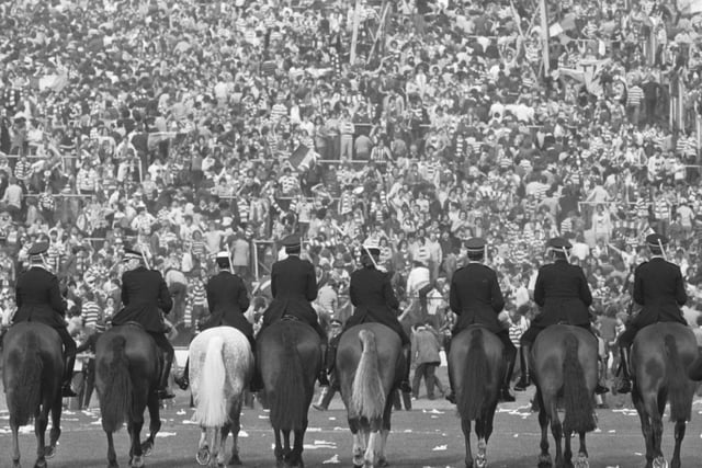 Mounted police face the fans before crowd trouble broke out after the Old Firm Scottish Cup Final at Hampden in May 1980, which Celtic won 1-0.