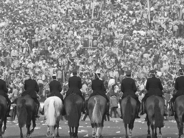 Mounted police face the fans before crowd trouble broke out after the Old Firm Scottish Cup Final at Hampden in May 1980, which Celtic won 1-0.