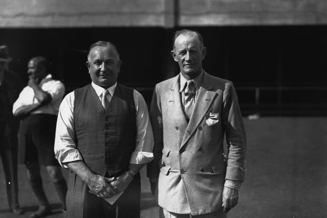 Herbert Chapman poses with a Mr Foster as part of a scheme to create football classes at Arsenal.