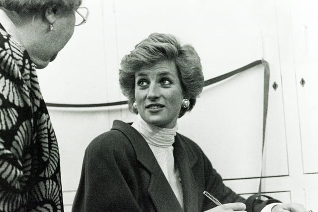 HRH Princess Diana is shown signing the visitors' book at the Family Service Unit at Sheffield Children's Hospital in November 1989.