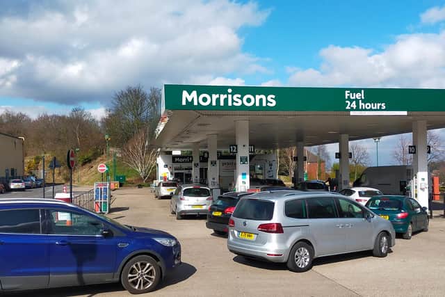 Queueing cars at Morrisons in Meadowhead at 12pm. At this time, seven unleaded petrol pumps had been tagged as "out of order" due to running low.