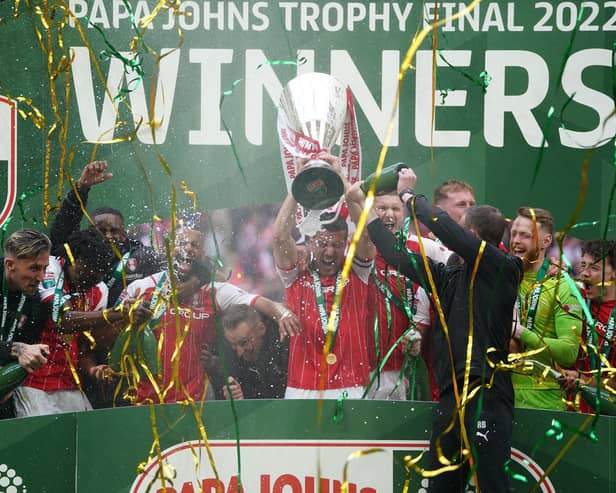 Rotherham United players celebrate on the winners podium with the Papa John's Trophy. (Zac Goodwin/PA Wire)