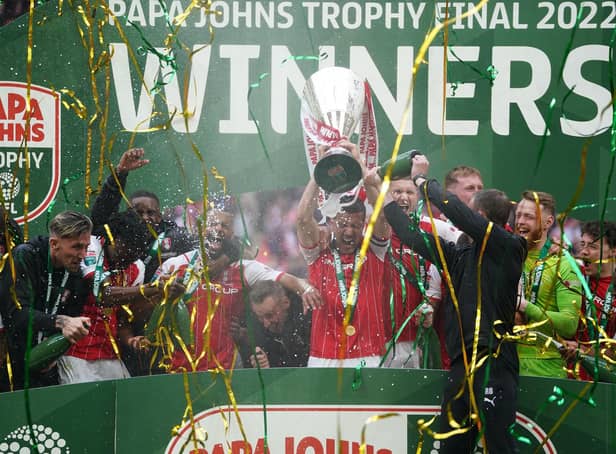 Rotherham United players celebrate on the winners podium with the Papa John's Trophy. (Zac Goodwin/PA Wire)