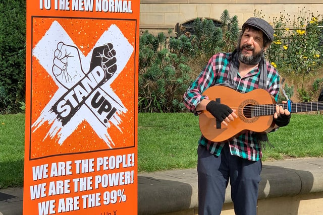 A musician played before the protest
