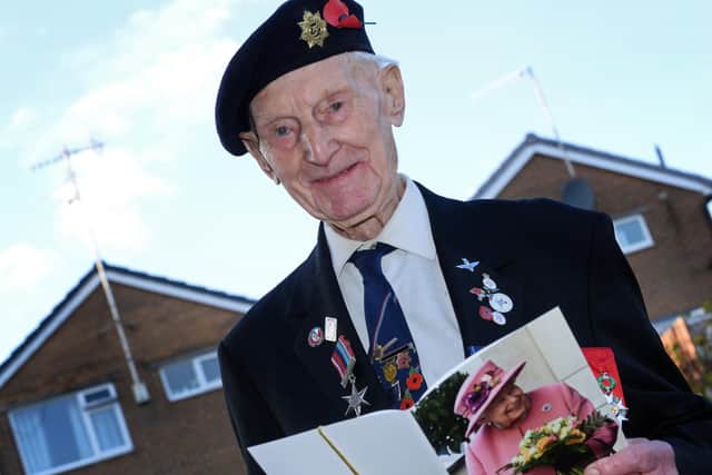 Cyril Elliott, pictured, with his Birthday card from the Queen. Picture: Marie Caley NSST-27-11-20-Elliott 6-NMSY