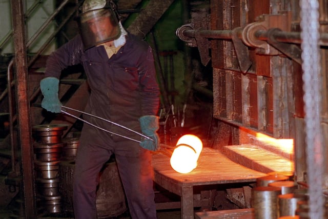 Jason Kenyon picking up "use" from the furnace in the Stamp and Lasco department at Daniel Doncasters, Penistone Road in 1999