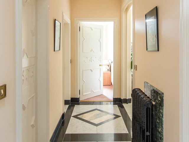 The house has marble floors and bright high ceilings