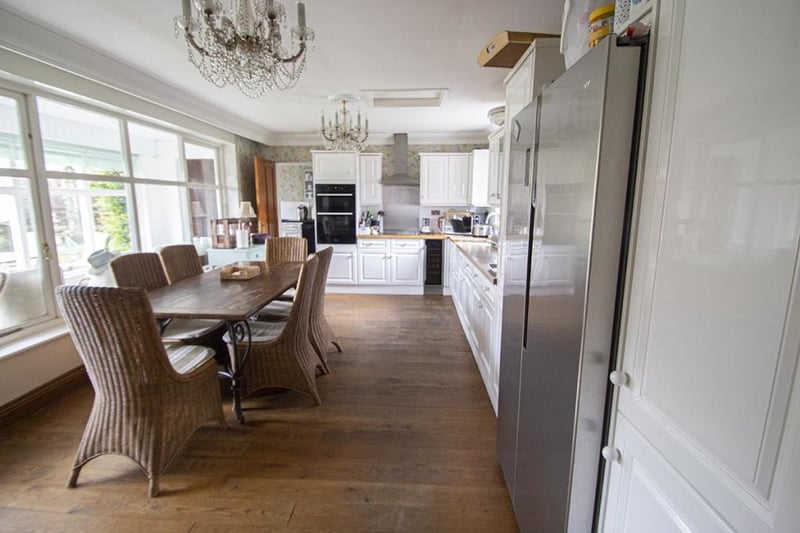 The kitchen has a range of appliances and overlooks the rear garden.