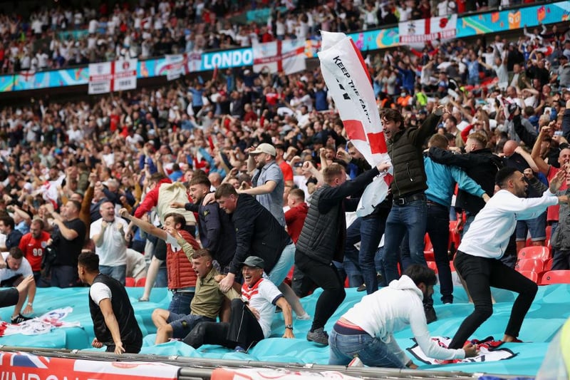 England fans celebrate against Germany. (Photo by Carl Recine - Pool/Getty Images)