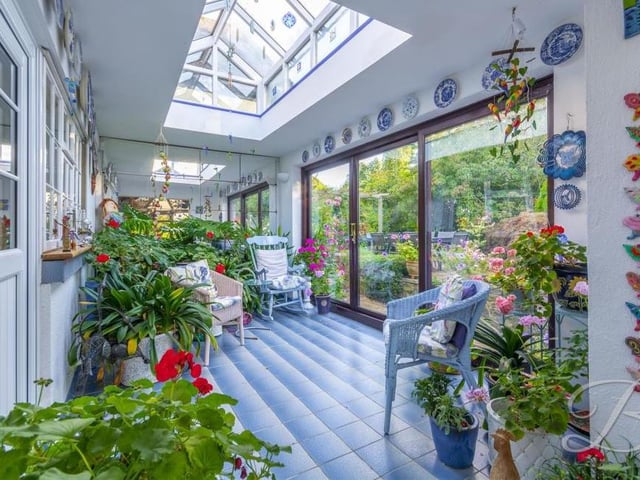 Not many properties can offer a garden room. But this is a marvellous place to sit and relax or admire the outdoor space, complete with a skylight, tiled floor and sliding doors to the back garden.