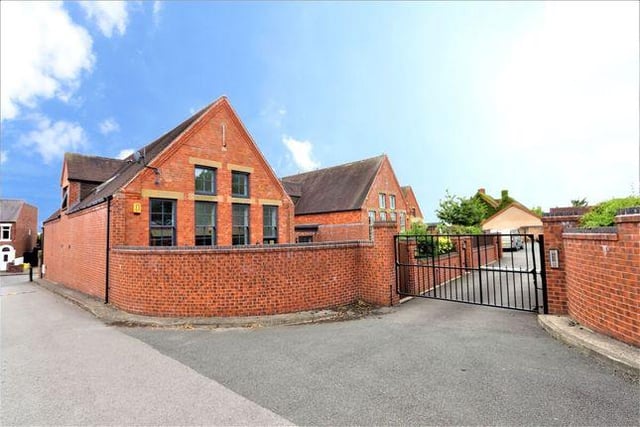 This four bedroom primary school conversion has a double height living room. Marketed by Your Move, 0115 774 9102.