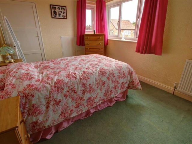 One of the three bedrooms.