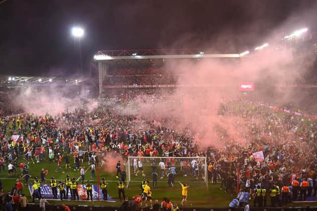 Nottingham Forest fans invade the pitch after beating Sheffield United on penalties in the play-offs (Michael Regan/Getty Images)