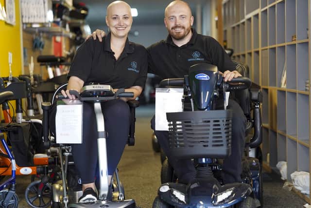 Jamie Cooper and his partner Natalie Parkes who run Sheffield Mobility in Hillsborough have vowed to help John Burkhill towards his £1 million fundraising goal. Picture Scott Merrylees