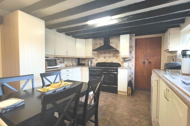 The traditional kitchen offers plenty of space and is perfect for cooking up a family feast