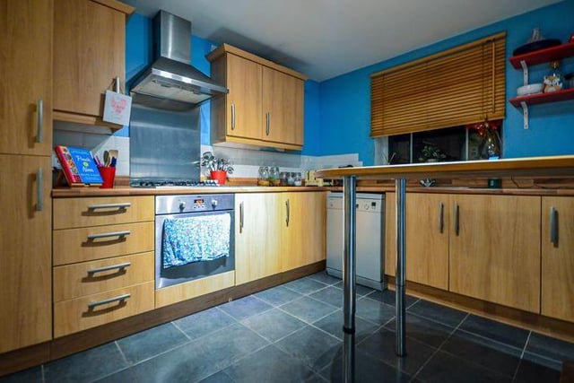 The kitchen is modern and attractive, with space for all the appliances you need, plus plenty of work and storage space.
