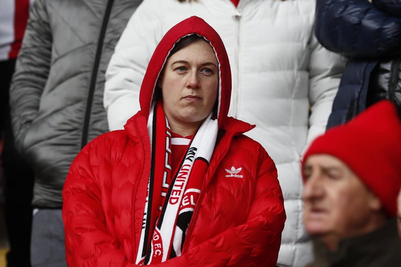 A United fan before the Brighton & Hove Albion game at the Lane in February 2020.